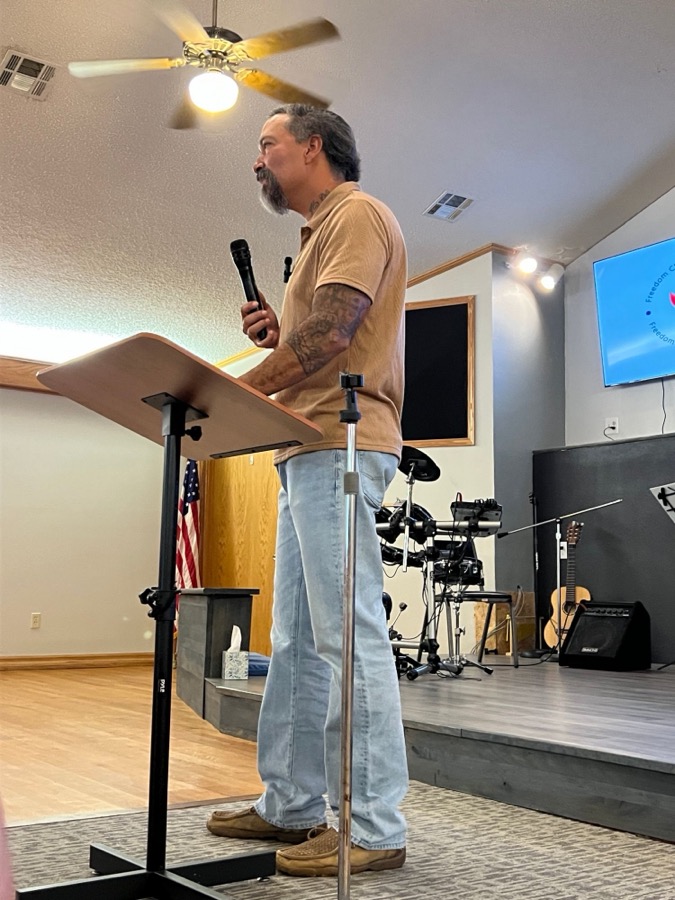 Pastor Moses preaching on a Sunday morning